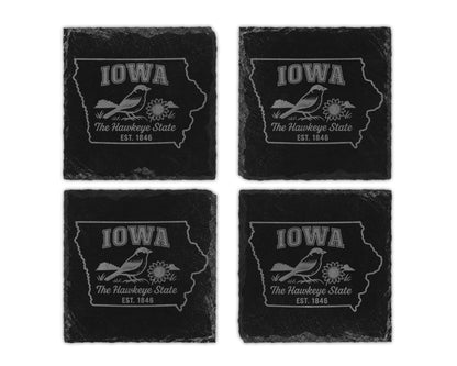Set of four Iowa slate coasters with bird and flower design.