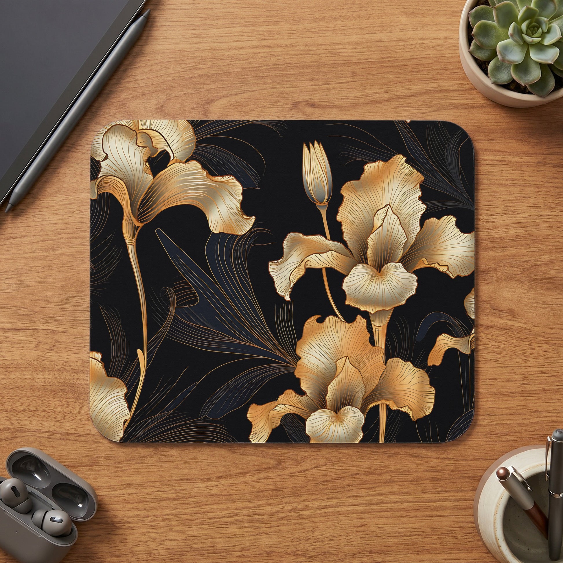 Mousepad with a gold iris floral pattern on a black background.