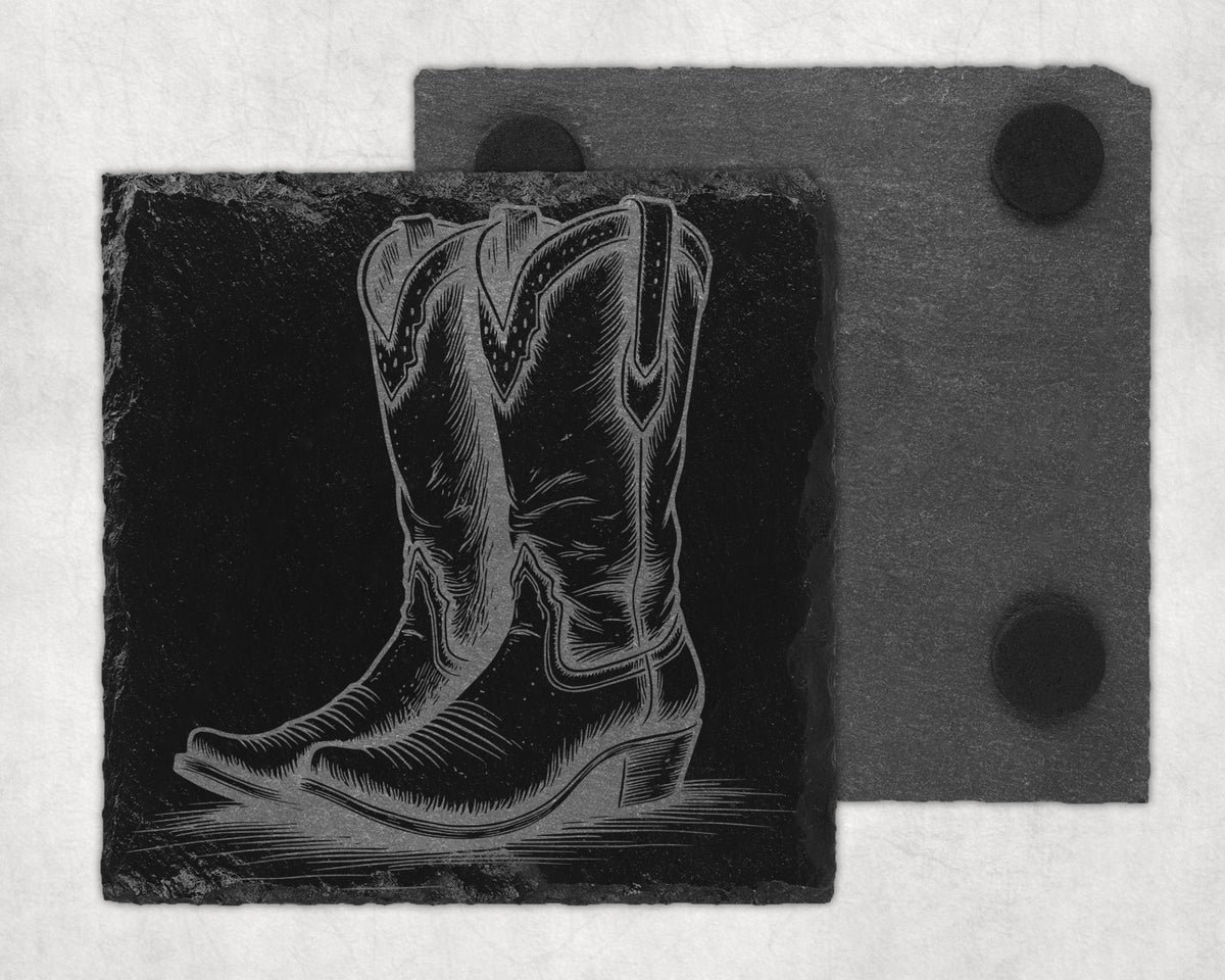 Black slate coaster with engraved cowboy boot design and felt backing.