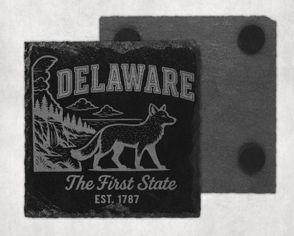 Black slate coaster with engraved Delaware landscape, fox, and text.