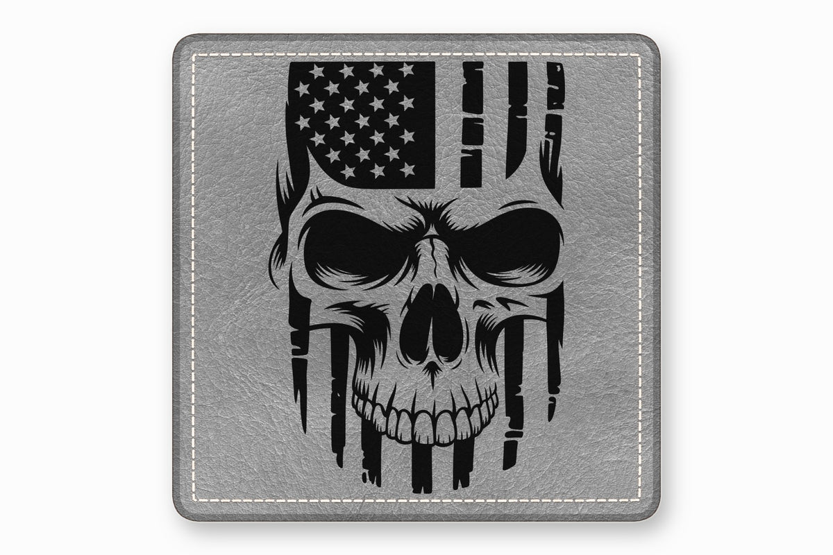 A square grey leather patch features a black graphic of a skull combined with an American flag.