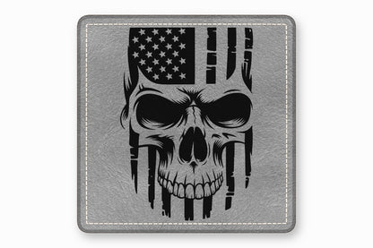 A square grey leather patch features a black graphic of a skull combined with an American flag.