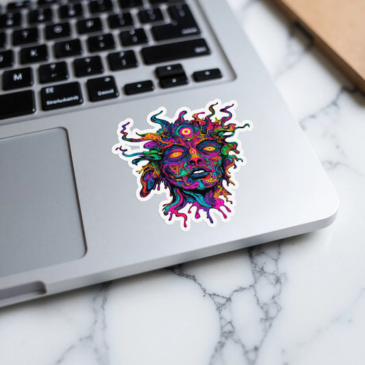 Colorful psychedelic face sticker with vibrant, swirling hair on a laptop.