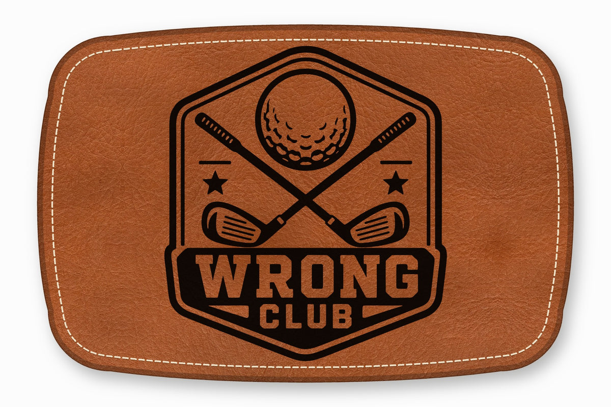 Brown leather patch with rounded corners featuring a black golf emblem and the text WRONG CLUB.