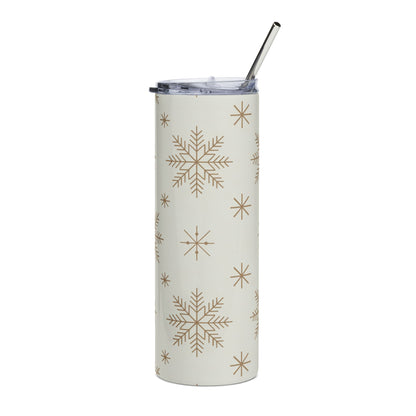 Cream tumbler with gold snowflakes and a silver straw.