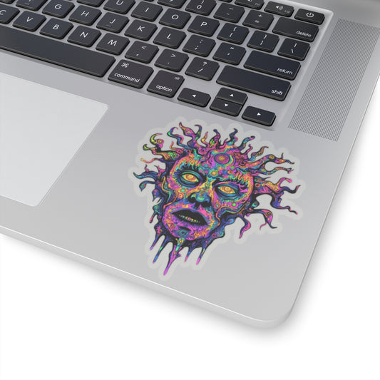 Colorful, abstract face sticker on a laptop keyboard.