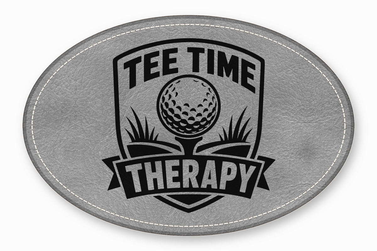Gray oval leather patch featuring a black golf graphic and the text Tee Time Therapy.