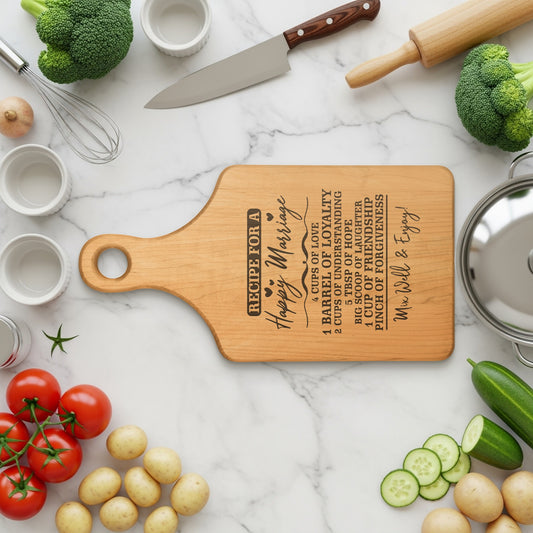 Wooden cutting board with "Recipe for a Happy Marriage" engraved.