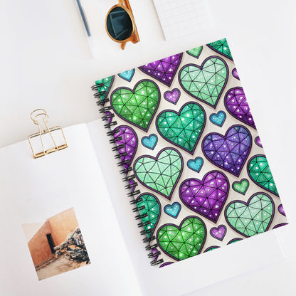 Spiral notebook with a repeating pattern of colorful stained-glass hearts.