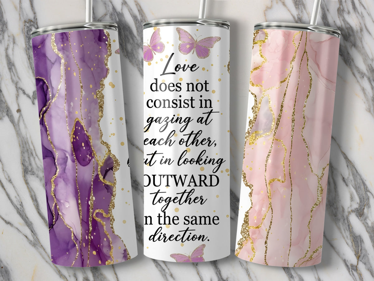 Three tumblers with marble, gold, and butterfly designs, one featuring quote about love.