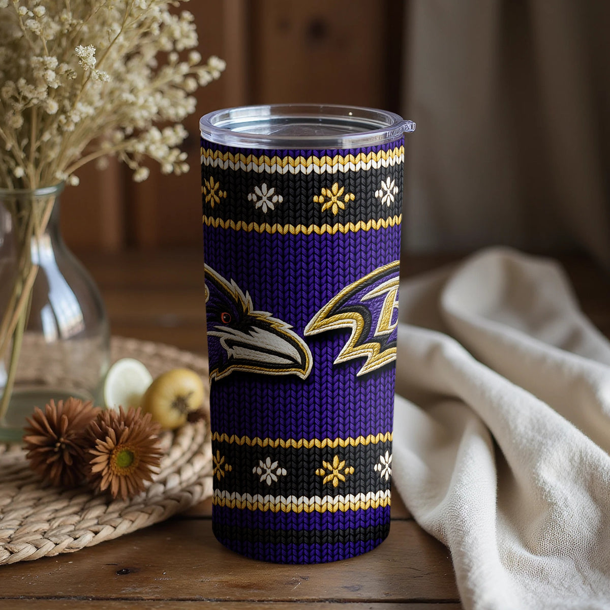 Baltimore Ravens tumbler with a knitted pattern and snowflake design.