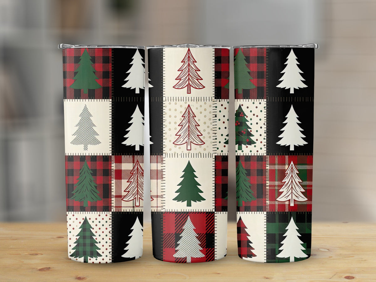 Three tumblers with a patchwork design of Christmas trees and plaid patterns.