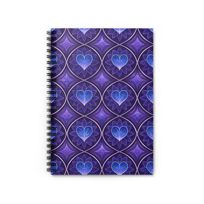 Spiral-bound notebook with purple and blue patterned cover featuring hearts.
