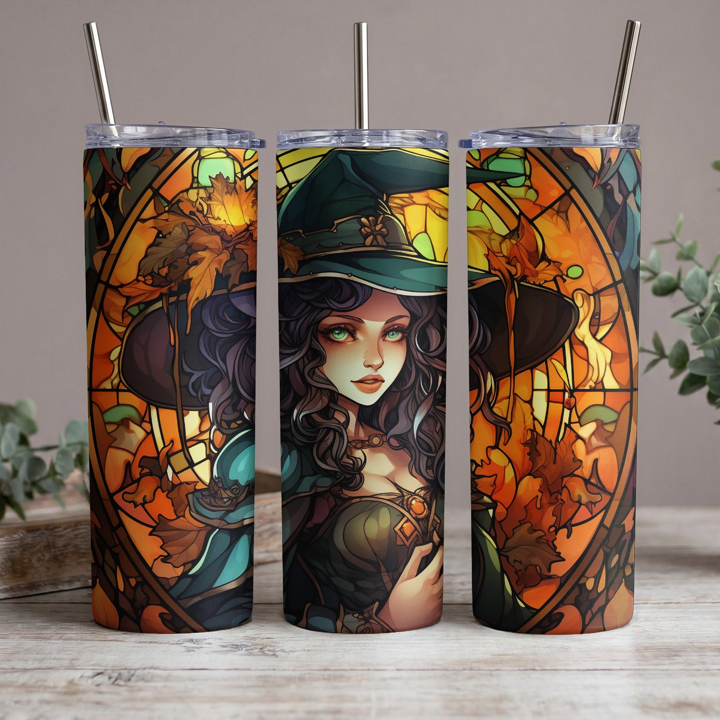 Three tumblers with stained-glass-style witch and autumn leaf art.