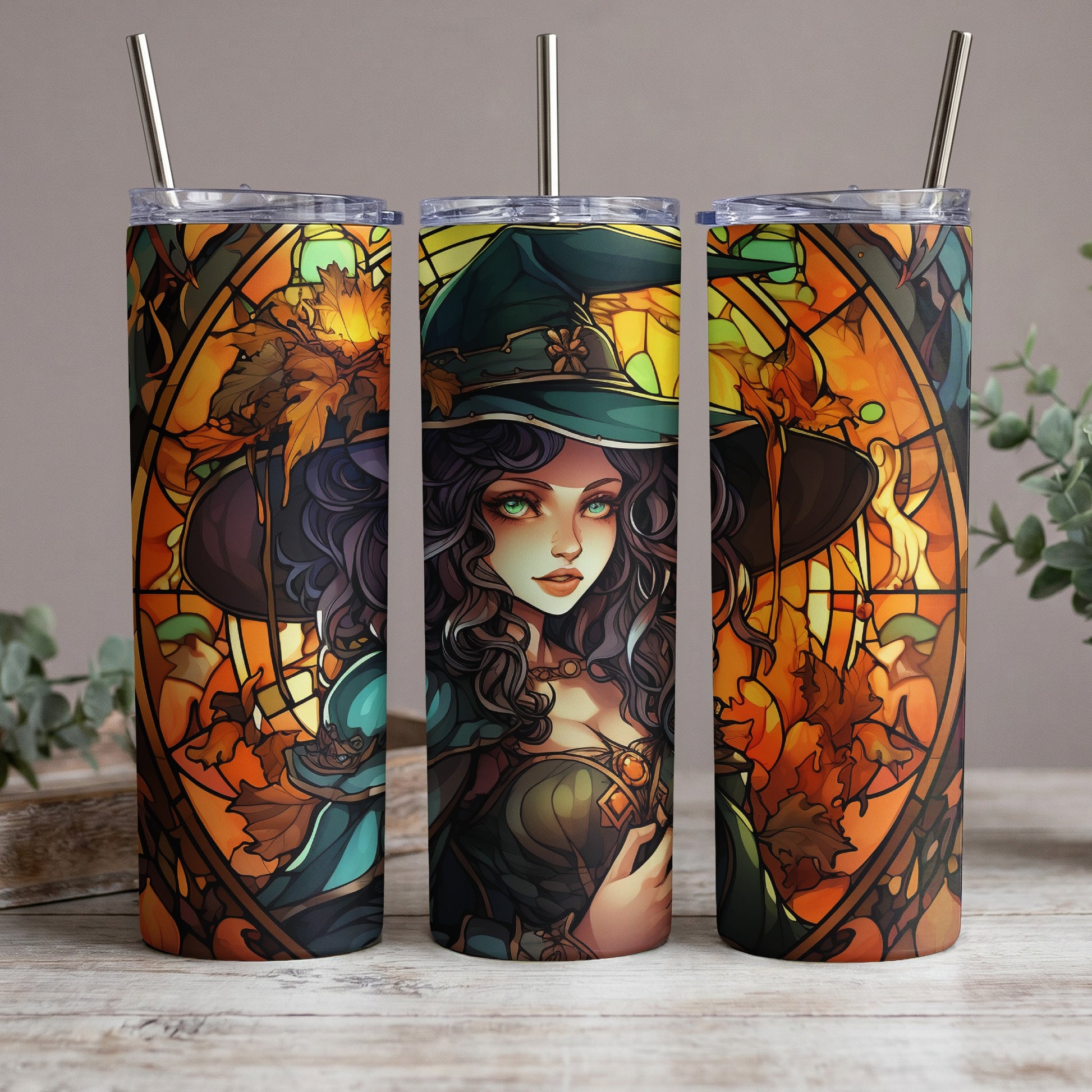 Three tumblers with stained-glass-style witch and autumn leaf art.