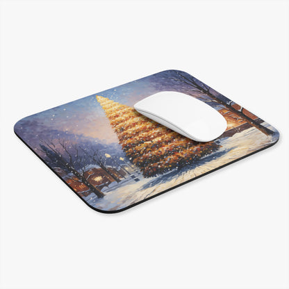 Mousepad featuring a watercolor painting of a snow-covered village with a lit Christmas tree.