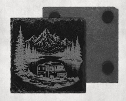 Slate coaster engraved with a vintage camper and mountain landscape scene.
