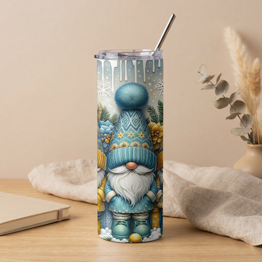 Tumbler with blue and yellow gnome winter pattern, snowflakes, and drips.