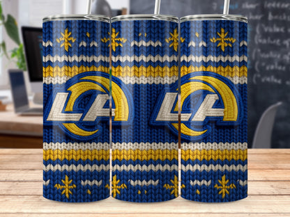 LA Rams logo on a blue, yellow, and white knitted tumbler with snowflakes.