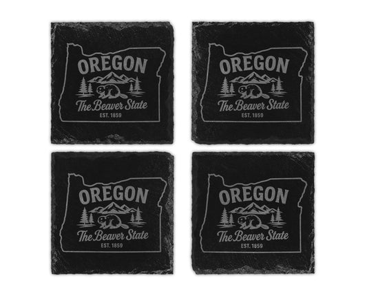 Four slate coasters featuring the Oregon state outline with beaver and mountains design.
