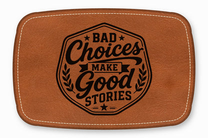 Brown faux leather patch with white stitched border and black stamped text reading Bad Choices Make Good Stories.