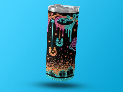 Tumbler with neon cowboy boot, horseshoe, and cactus pattern on a black background.