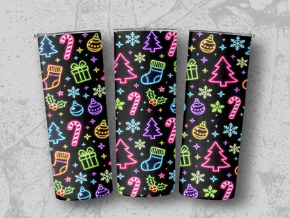 Three tumblers with a repeating neon Christmas pattern on a dark background.