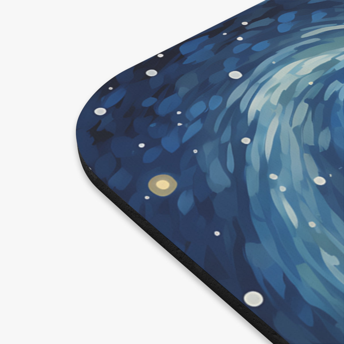 Mousepad with a dark blue swirling starry night design and white dots.