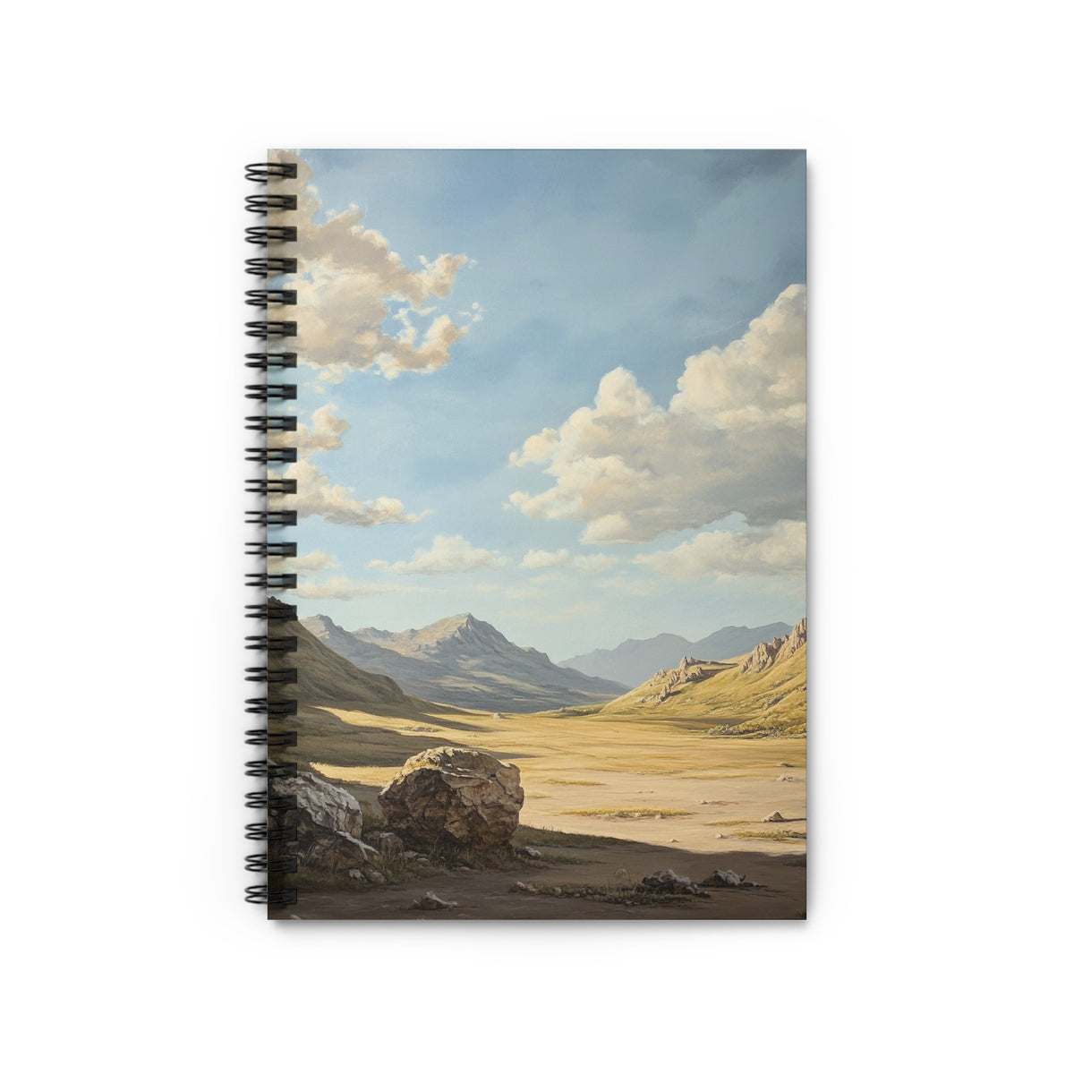 Spiral-bound notebook with a landscape painting of a desert valley and mountains.