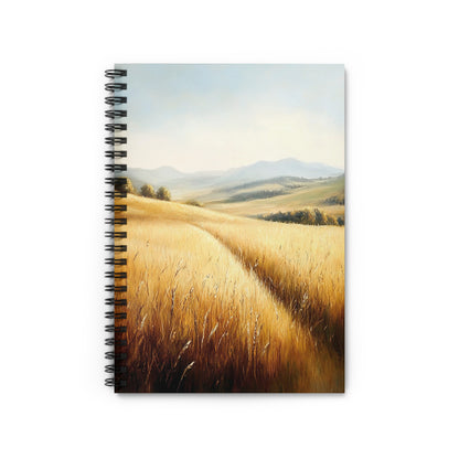 Spiral notebook with painting of golden wheat fields and rolling hills.