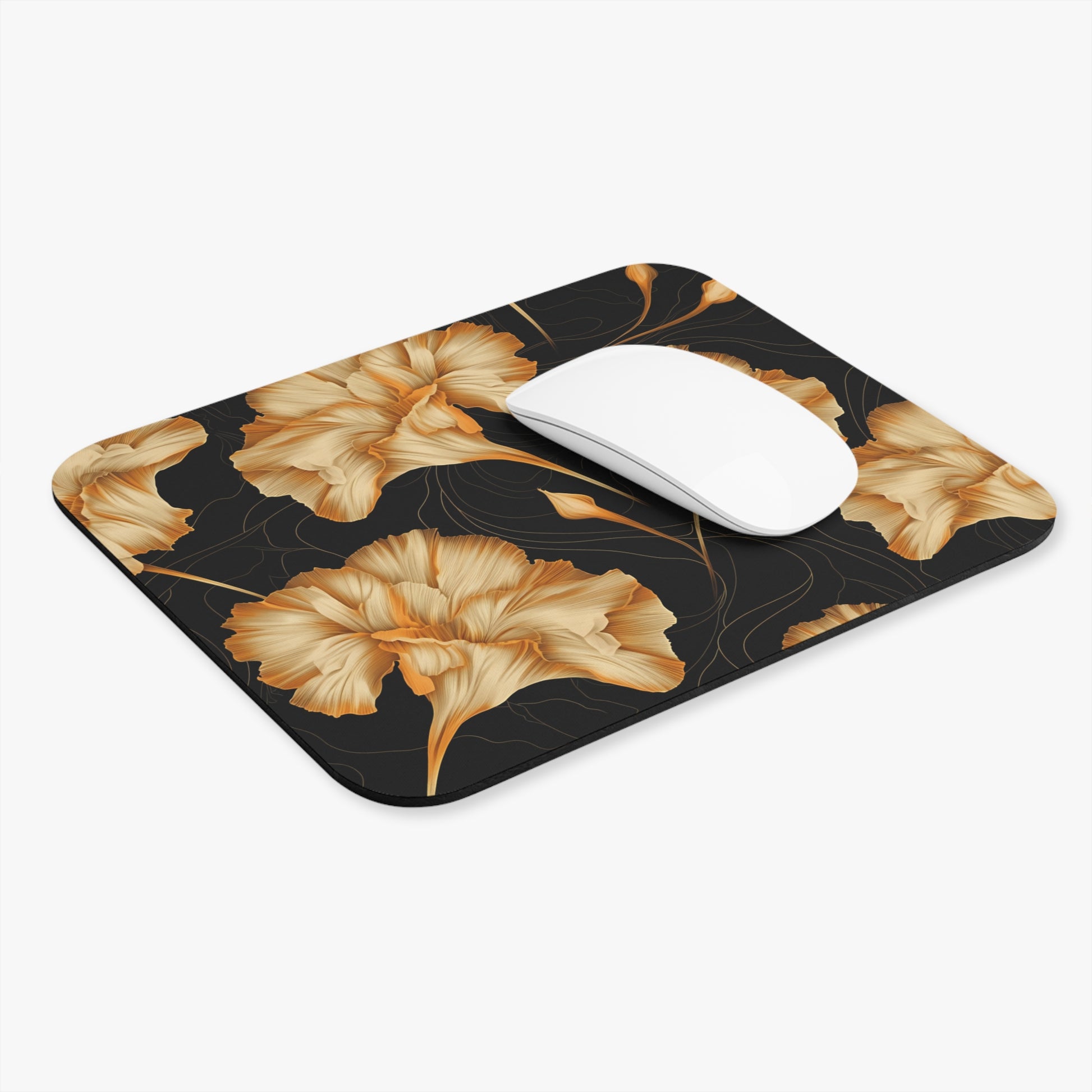 Mousepad with gold floral pattern on black background and white mouse.