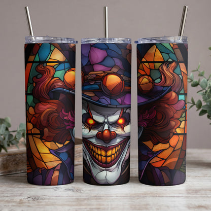 Three tumblers with a creepy clown stained glass design and metal straws.