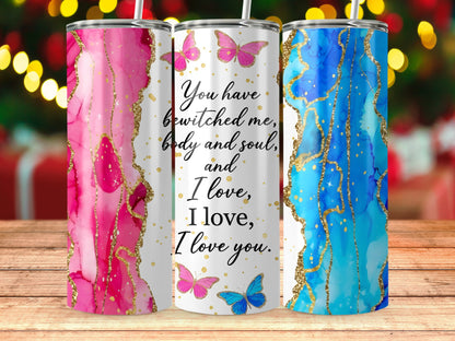 Three tumblers with marble patterns, gold trim, and romantic text.