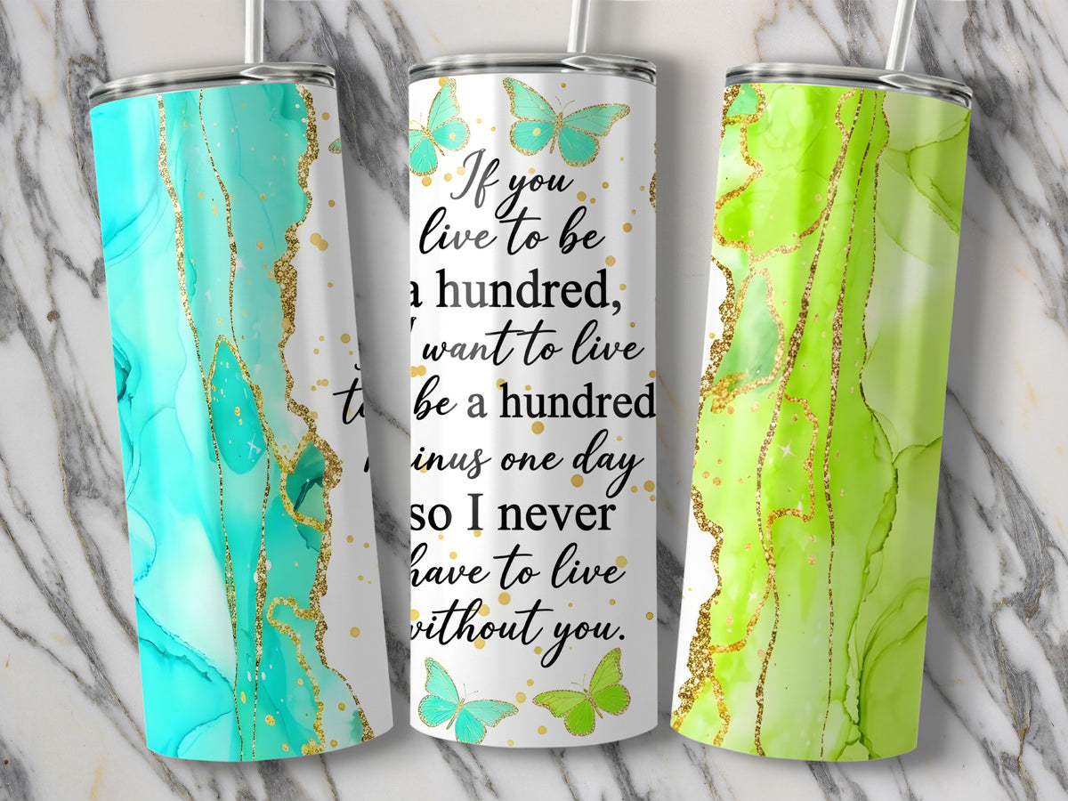 Tumblers with marble and gold accents featuring butterflies and quote.