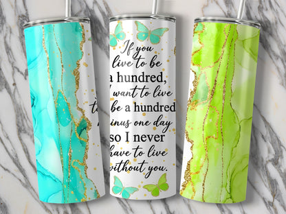 Tumblers with marble and gold accents featuring butterflies and quote.