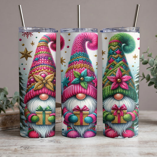 Three tumblers featuring watercolor gnomes holding gifts with festive winter backgrounds.