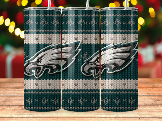 Philadelphia Eagles logo on a teal and white knit pattern tumbler with straw