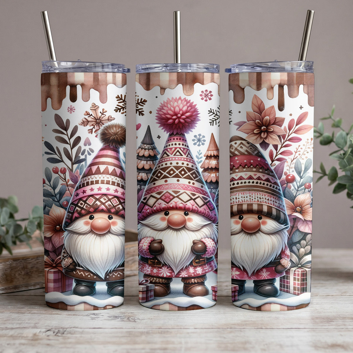 Three tumblers feature watercolor gnomes, snowflakes, and floral designs.
