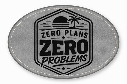 Oval gray leather patch featuring a black badge, palm tree graphic, and text reading Zero Plans Zero Problems.