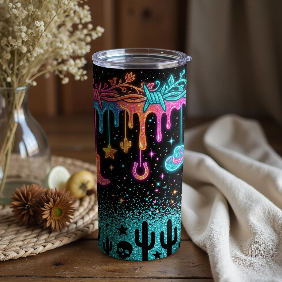 Black tumbler with neon western-themed designs and glitter accents.