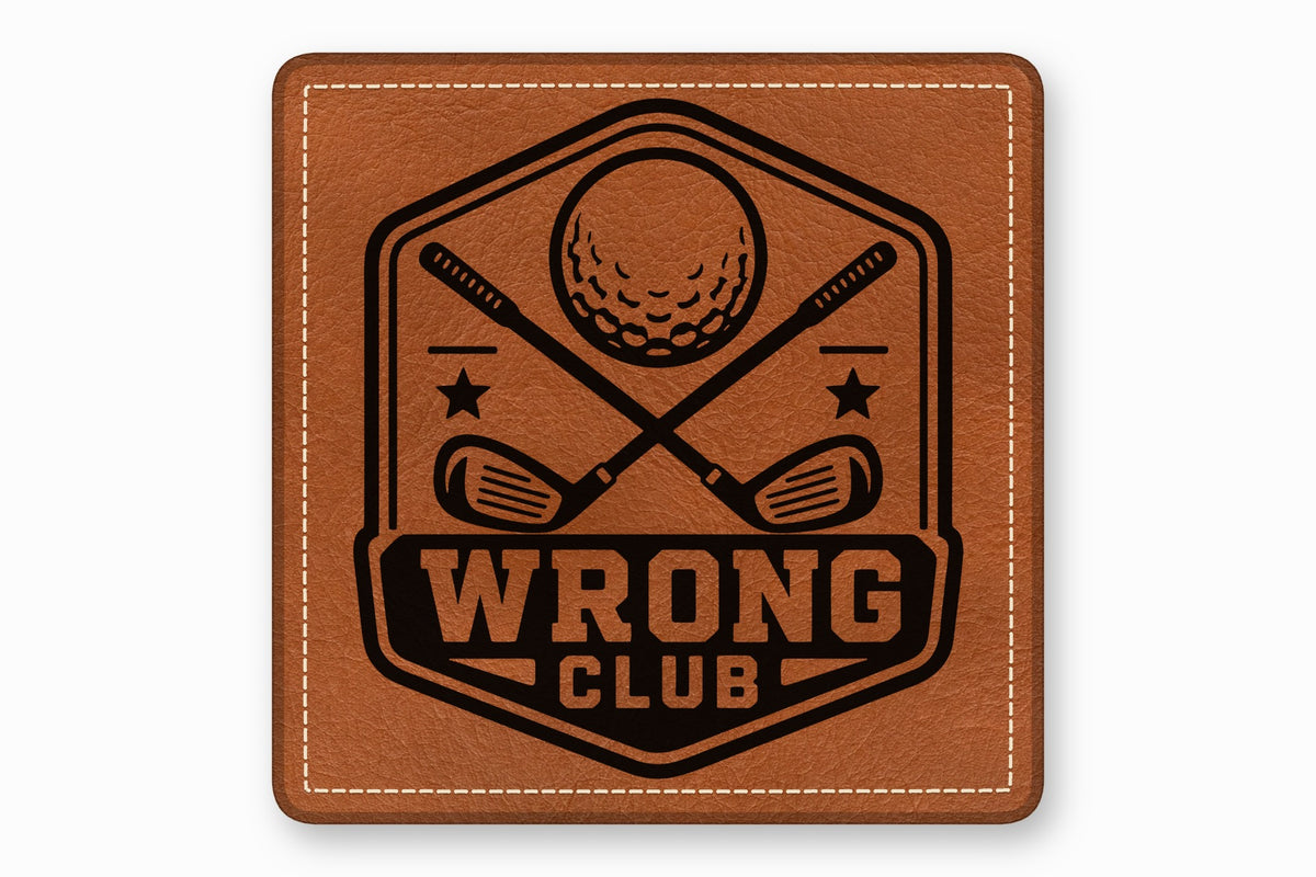 Square brown leather patch with white stitched borders and a black golf-themed logo and text reading WRONG CLUB.
