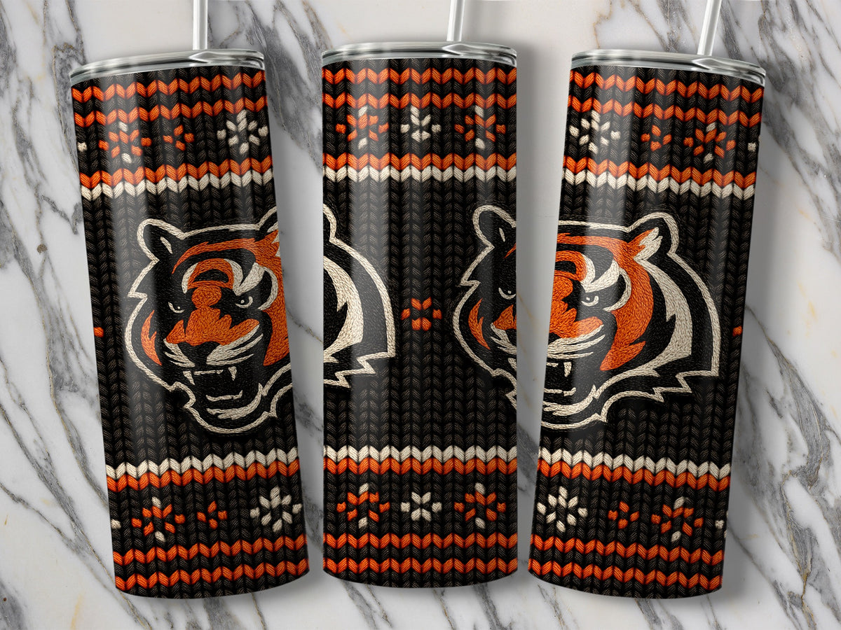 Tigers head with a knitted pattern on three tumblers against a marble background.