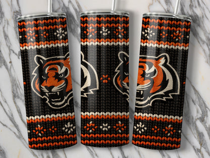 Tigers head with a knitted pattern on three tumblers against a marble background.