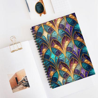 Spiral notebook with abstract stained-glass pattern in teal, purple, and gold.