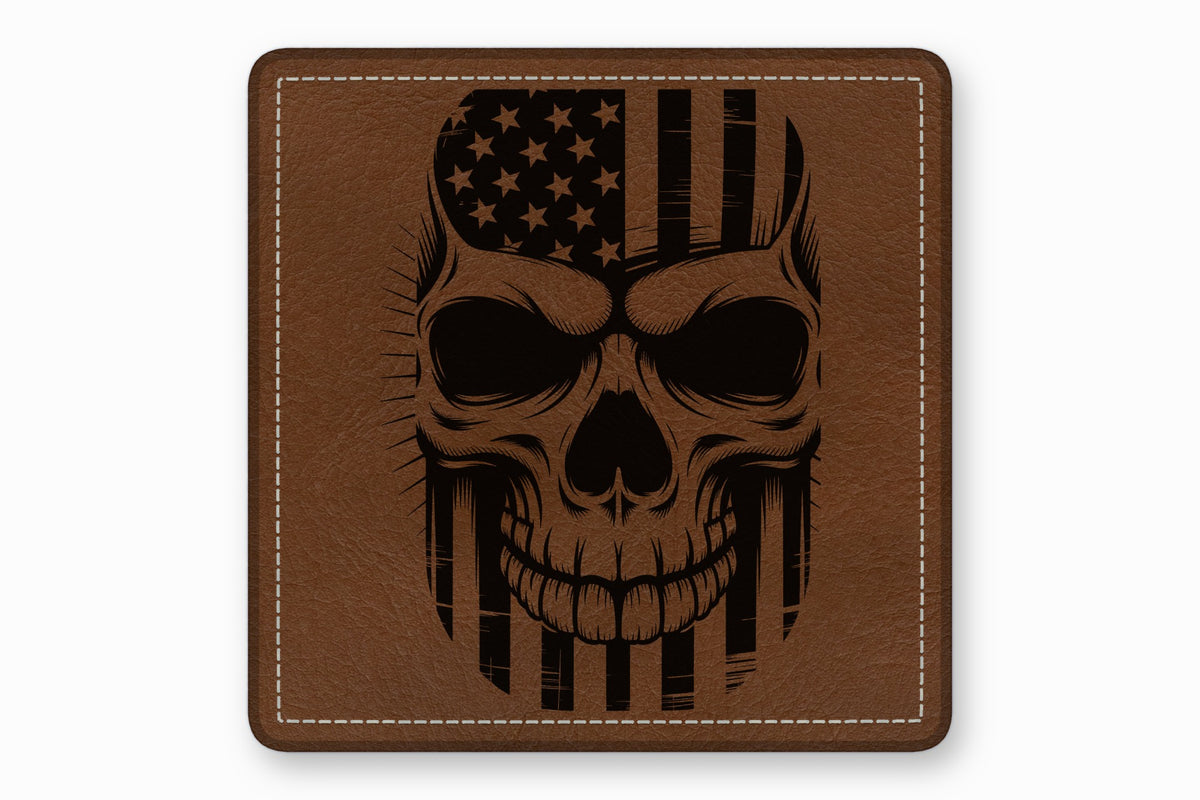 Square brown leather patch with white stitched border featuring a black engraved skull and American flag design.