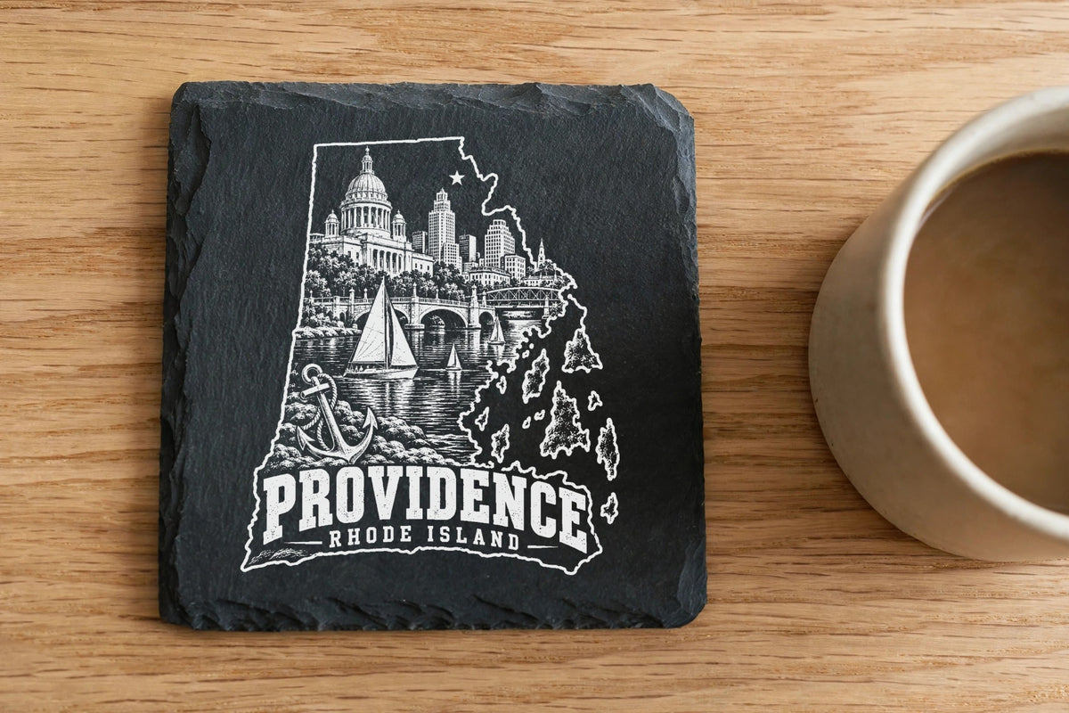 Square black slate coaster engraved with a white map of Providence, Rhode Island, featuring city landmarks, sailboats, and the text Providence, Rhode Island.