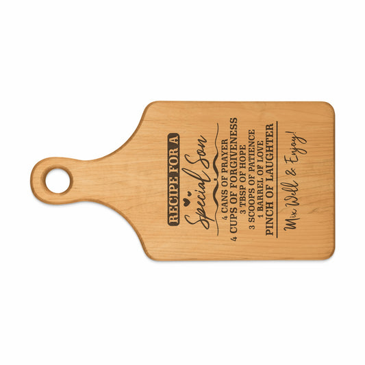 Wooden cutting board with "Recipe for a Special Son" and ingredient list.