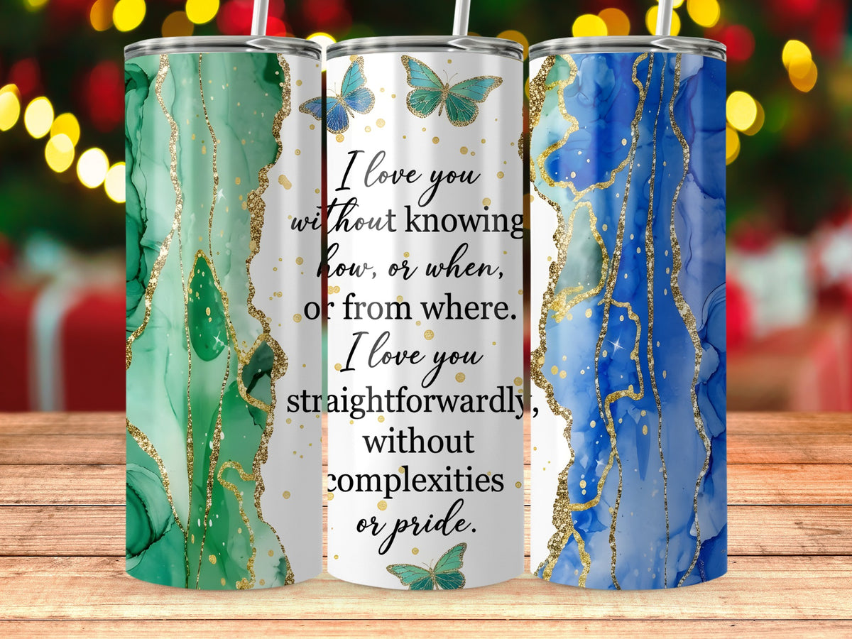 Three tumblers with marble-like designs and inspirational quotes.