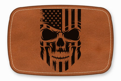 Brown leather patch with rounded corners, white stitching, and a distressed American flag skull graphic.