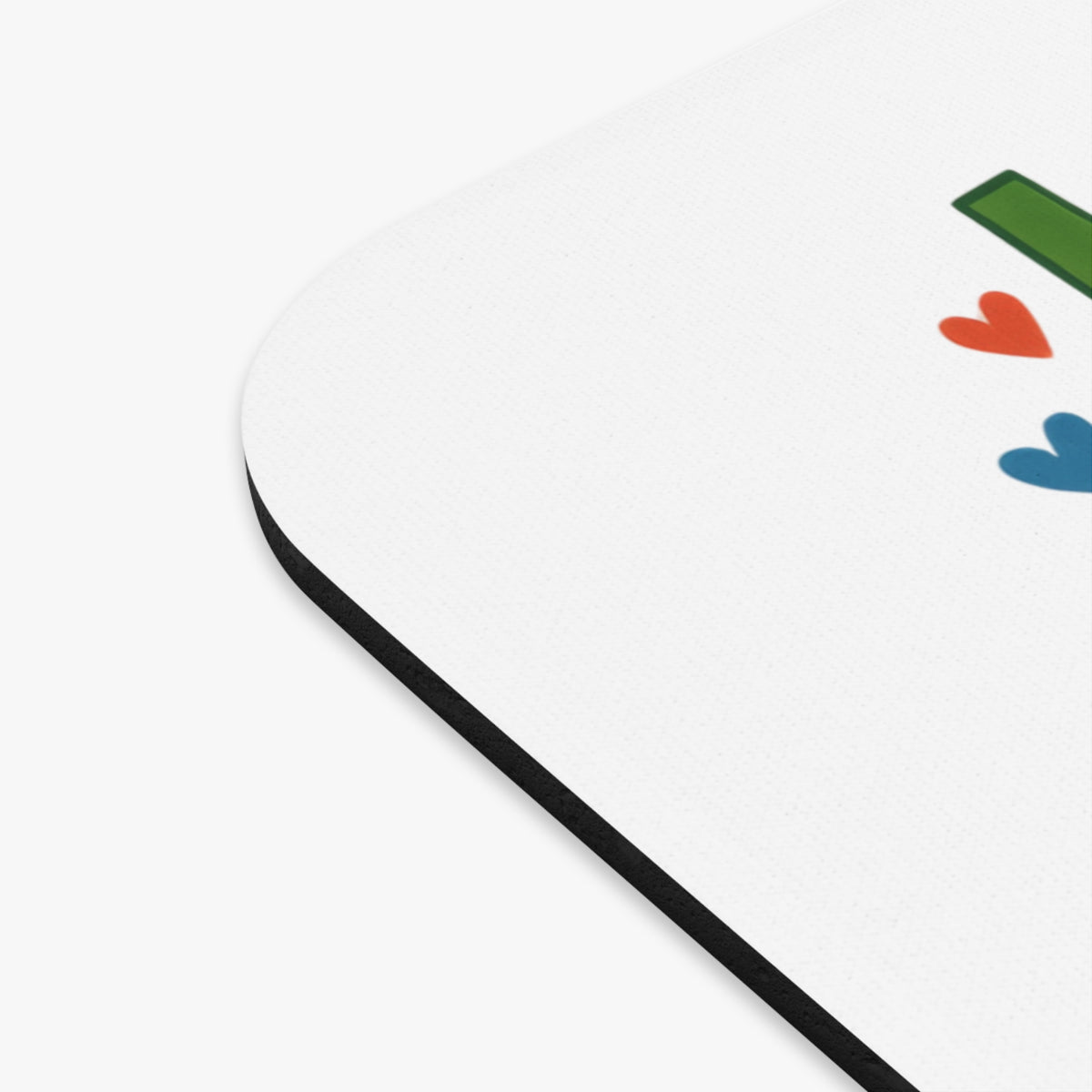 White mousepad with green line and red and blue hearts design.
